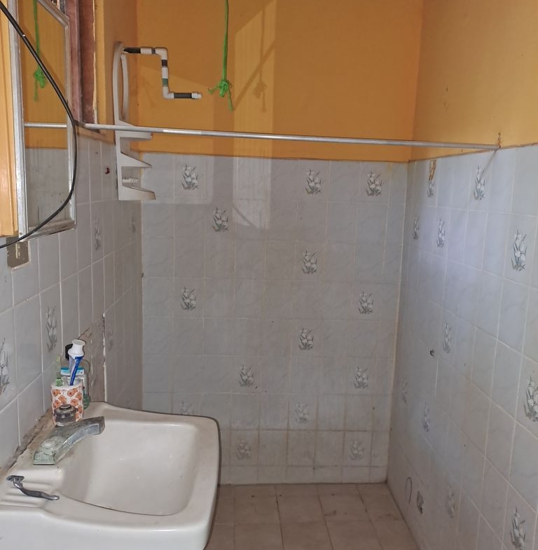 Sink and shower of Casa de la Playa, home for sale at Samara Beach, Guanacaste, Costa Rica