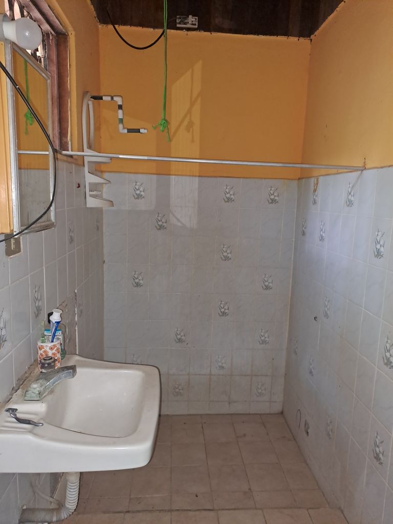 Sink and shower of Casa de la Playa, home for sale at Samara Beach, Guanacaste, Costa Rica