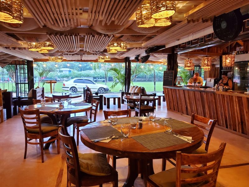 modern wooden tables of Restaurant Gourmet Sol y Vino for sale at Samara, Costa Rica