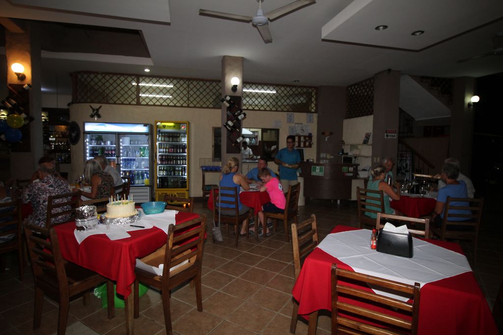 Red tablecloth on tables sof Casa Emerald, Restaurant and Cabinas for sale at Samara Beach, Guanacaste, Costa rica