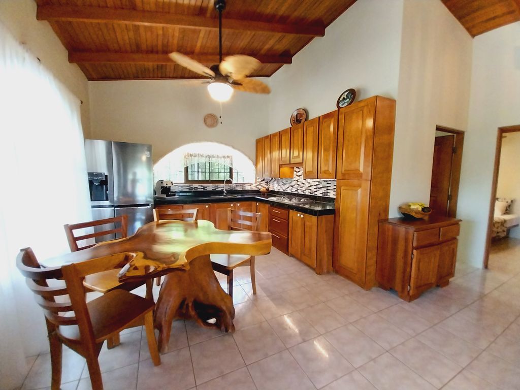 Rustic wooden table of Casa Bella Montaña, home for sale at Samara Beach, Guanacaste, Costa Rica