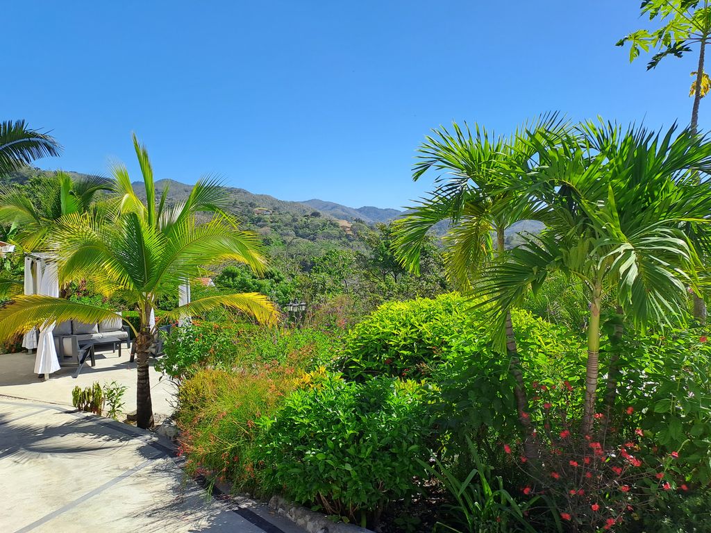 Gorgeous mountain and jungle view from the tropical garden of Casa Bella Montaña home for sale Samara Beach Guanacaste Costa Rica