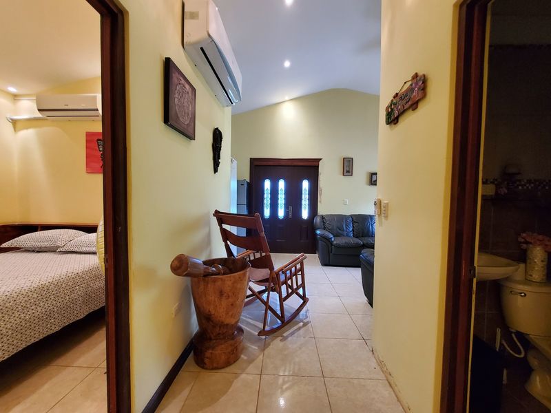 Corridor and his wooden decoration at Casa Luz, house for sale at Carrillo Beach, Guanacaste, Costa Rica