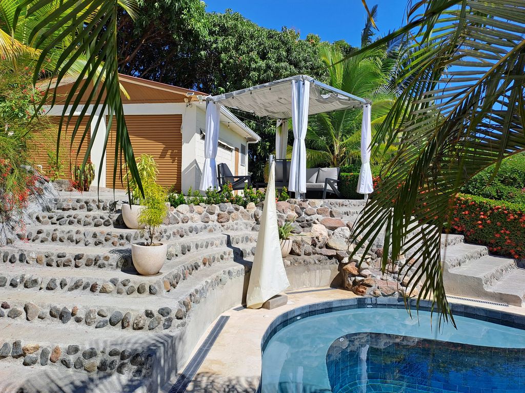 Stone retaining walls of Casa Bella Montaña, home for sale at Samara Beach, Guanacaste, Costa Rica