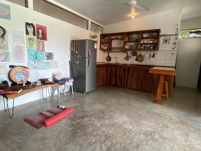 living area with kitchen at the holistic yoga retreat hotel for sale samara guanacaste costa rica