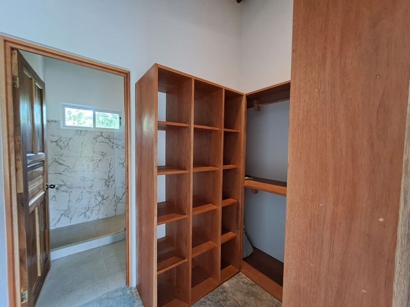 walking closet of Casa colina mono home for sale samara costa rica