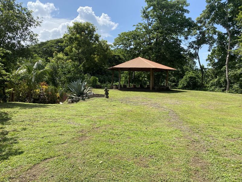 grassy area with yoga deck at the holistic yoga retreat hotel for sale samara guanacaste costa rica