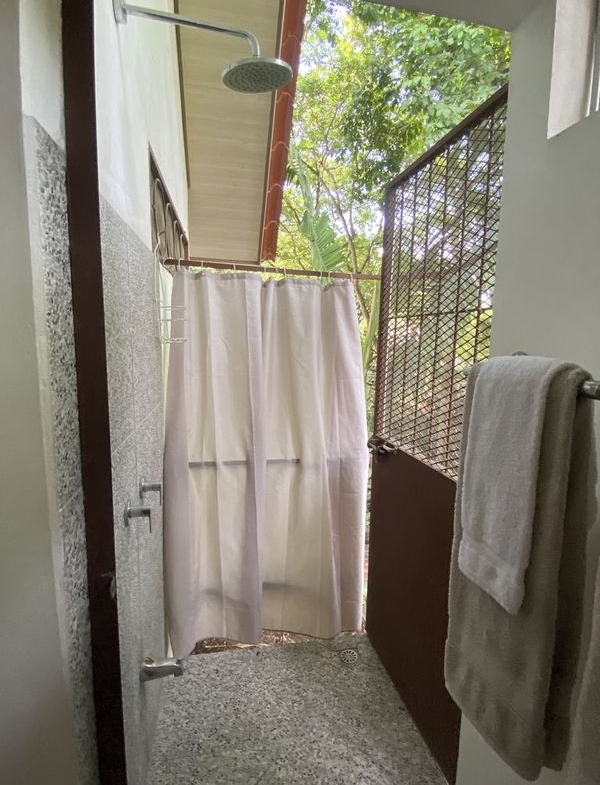 outdoor shower of the holistic yoga retreat hotel for sale samara guanacaste costa rica