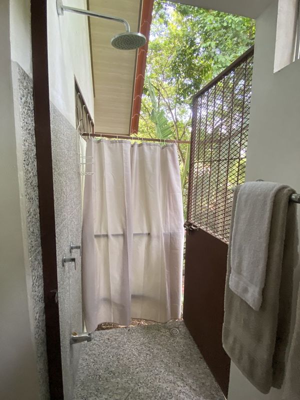 outdoor shower of the holistic yoga retreat hotel for sale samara guanacaste costa rica