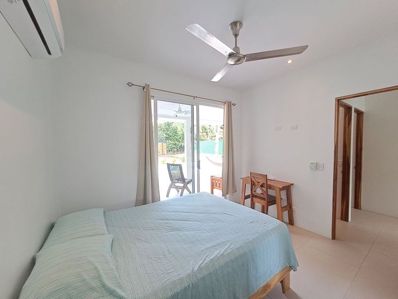 bright bedroom with queen bed at Casa Mar y sol home for sale samara guanacaste costa rica