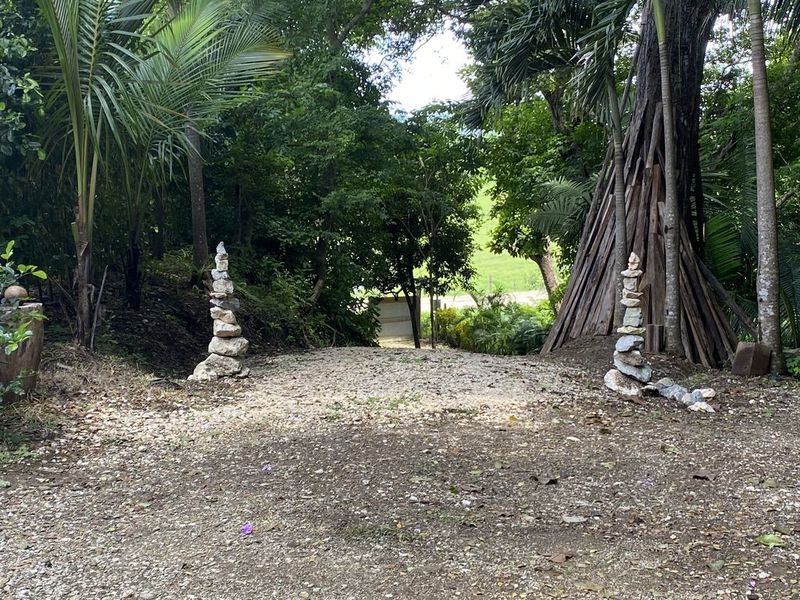 Stones showing the entrance of the holistic yoga retreat hotel for sale samara guanacaste costa rica